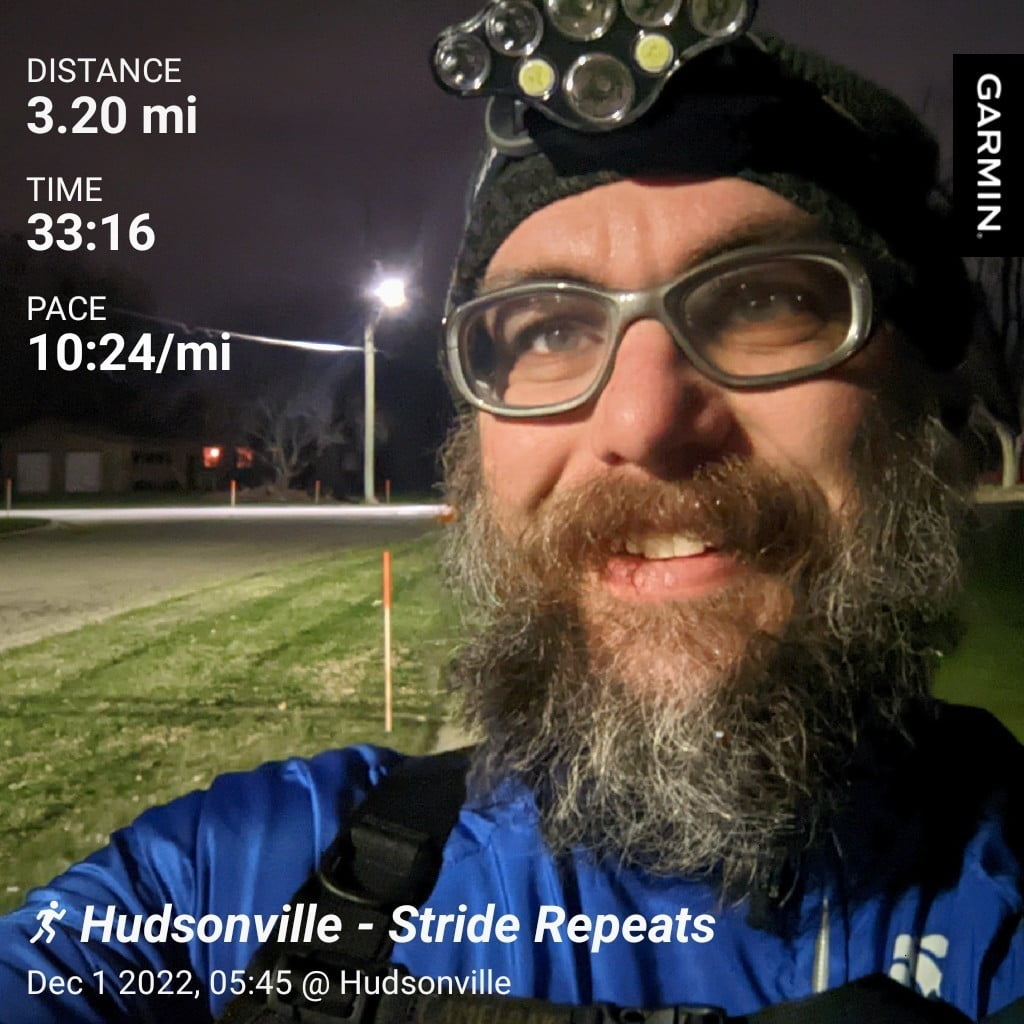 Distance: 3.2 miles, Time: 33:16, Pace: 10:24 min/mile | Hudsonville - Stride Repeats / Picture of me early in the morning in our neighborhood, street lights in the background.