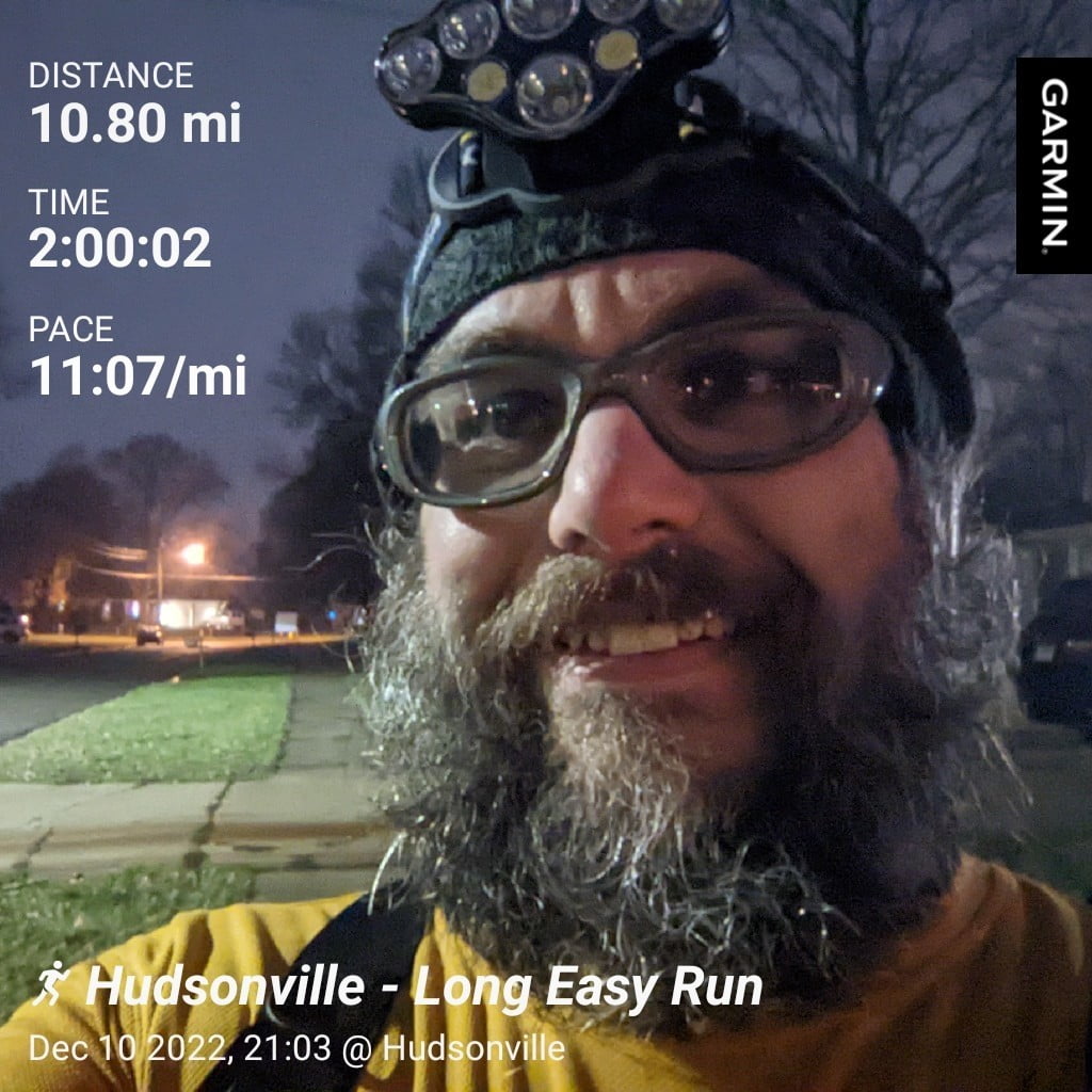 Distance: 10.8 miles, Time: 2:00:02, Pace: 11:07 min/mile | Hudsonville - Easy Long Run / Late night selfie on the sidewalk in the neighborhood with a street light in the background.