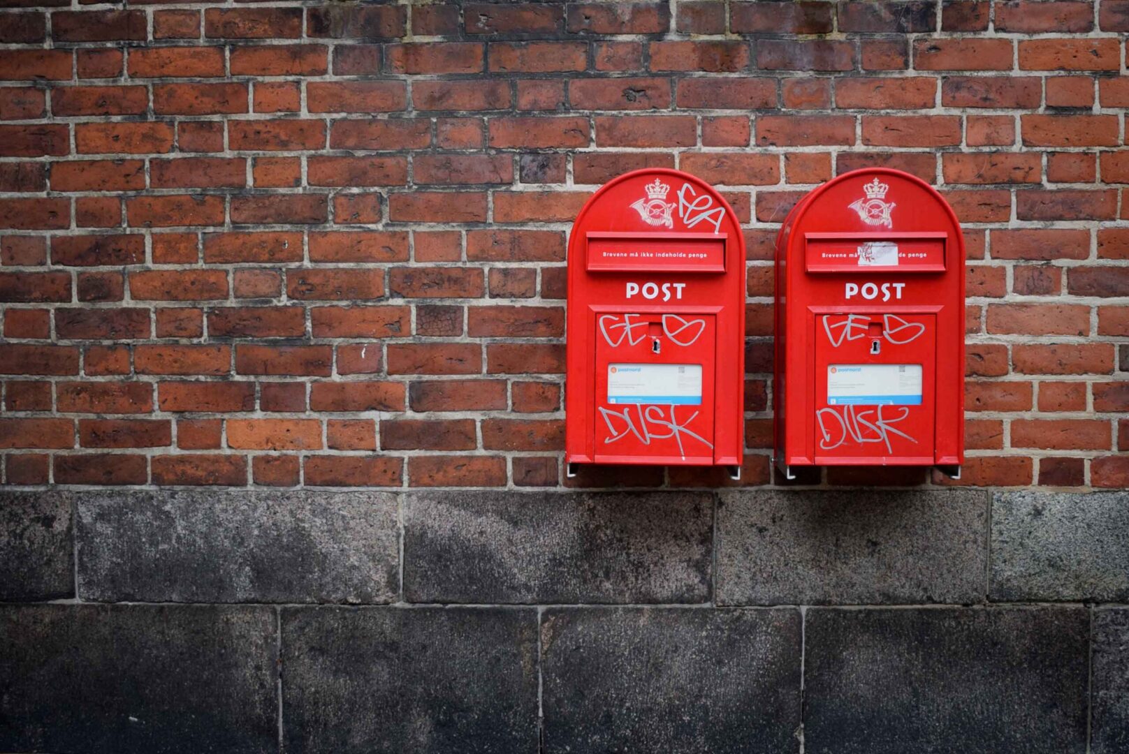 Mailboxes on a brick wall.